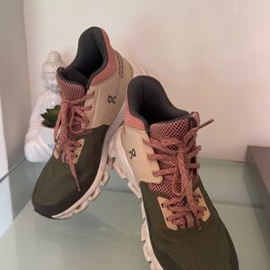 On Running Green and Pink Athletic Shoes with Modern Silhouette